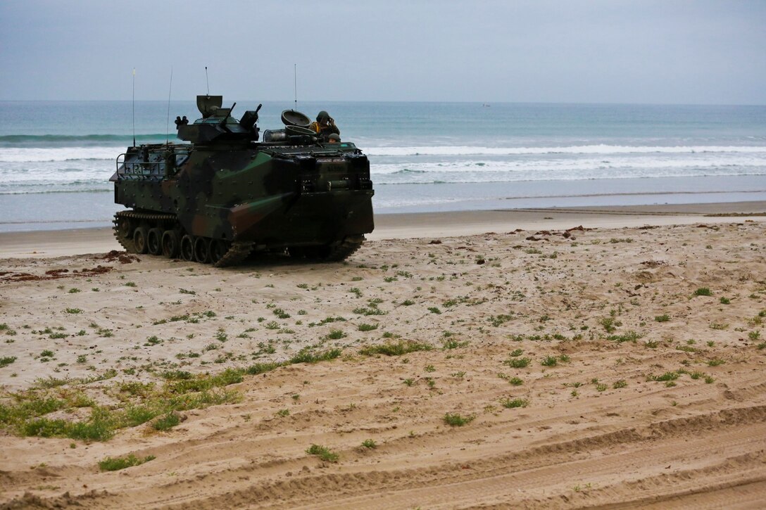 An AAV-7 Amphibious Assault Vehicle performs an amphibious landing during Exercise Iron Fist 2014 aboard Camp Pendleton, Calif., Feb. 19, 2014. Iron Fist is an amphibious exercise that brings together Marines and sailors from the 15th Marine Expeditionary Unit, other I Marine Expeditionary Force units, and soldiers from the Japan Ground Self-Defense Force, to promote military interoperability and hone individual and small-unit skills through challenging, complex and realistic training. (U.S. Marine Corps photo by Lance Cpl. Ricardo Hurtado/Released)