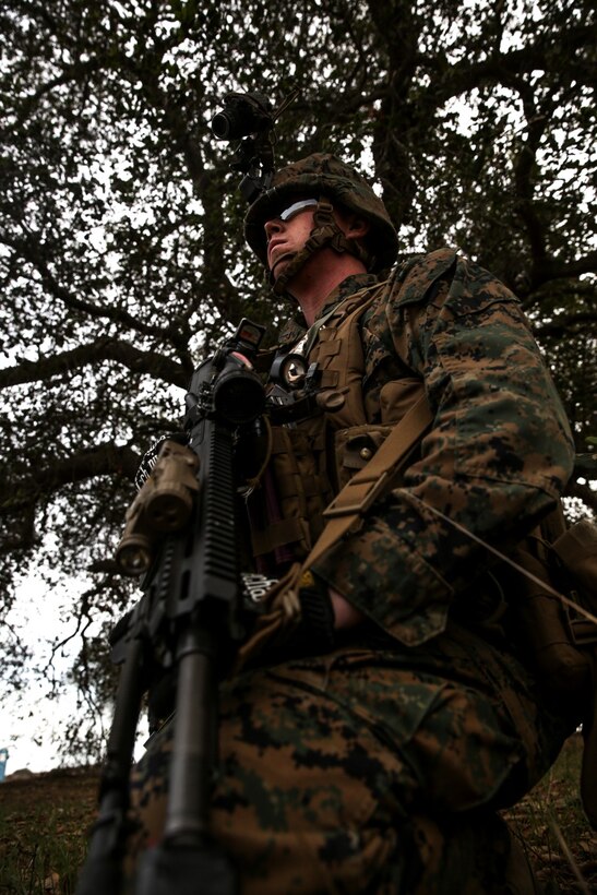 U.S. Marine Lance Cpl. Dooley Matthew, 1st Battalion, 1st Marine Regiment, provides security while conducting a helo insertion to a nighttime urban terrain raid training during Exercise Iron Fist 2014 aboard Camp Pendleton, Calif., Feb. 18, 2014. Iron Fist is an amphibious exercise that brings together Marines and sailors from the 15th Marine Expeditionary Unit, other I Marine Expeditionary Force units, and soldiers from the JGSDF, to promote military interoperability and hone individual and small-unit skills through challenging, complex and realistic training. (U.S. Marine Corps photo by Cpl. Emmanuel Ramos/Released)