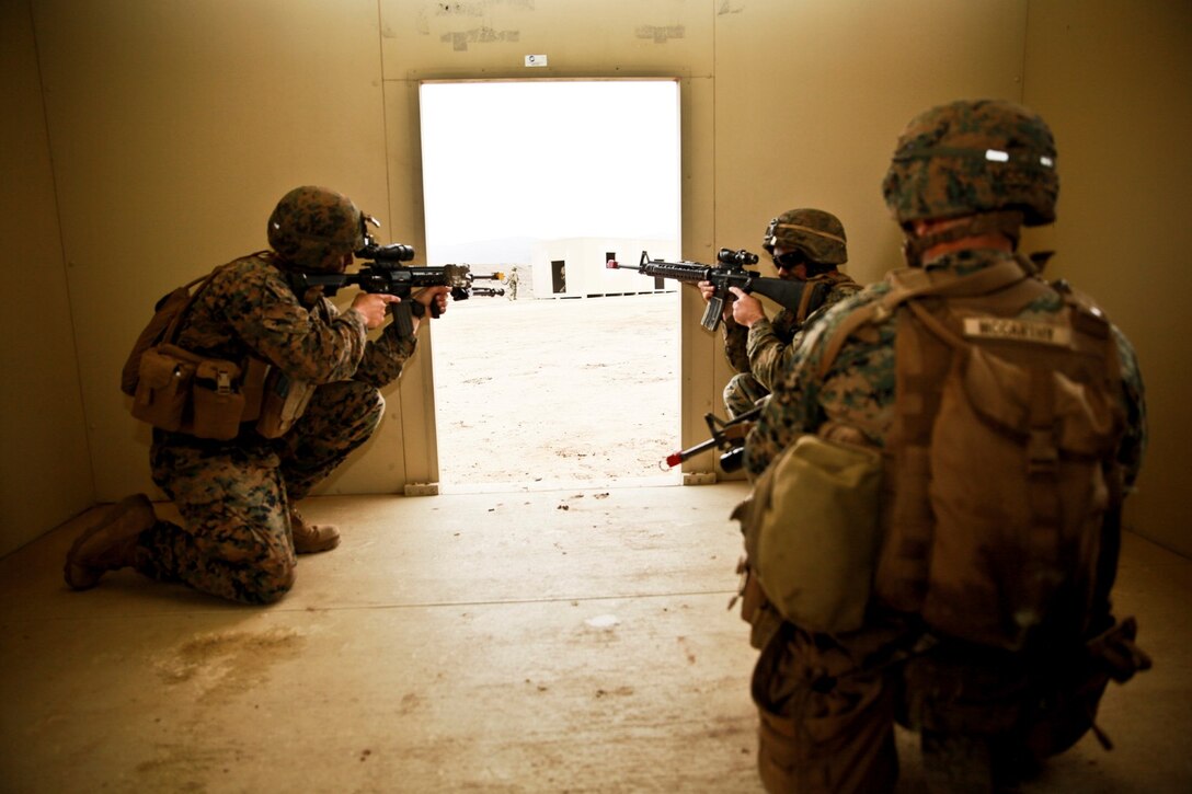 U.S. Marines with 1st Battalion, 1st Marine Regiment, post security while conducting an amphibious landing during Exercise Iron Fist 2014 aboard Camp Pendleton, Calif., Feb. 19, 2014. Iron Fist is an amphibious landing exercise that brings together Marines and sailors from the 15th Marine Expeditionary Unit, other I Marine Expeditionary Force units, and soldiers from the Japan Ground Self-Defense Force, to promote military interoperability and hone individual and small-unit skills through challenging, complex and realistic training. (U.S. Marine Corps photo by Lance Cpl. Ricardo Hurtado/Released)