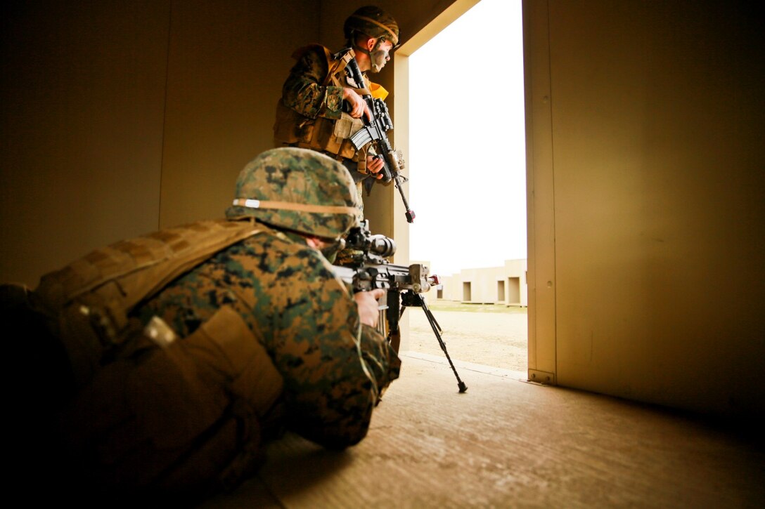 U.S. Marines with 1st Battalion, 1st Marine Regiment, post security while conducting an amphibious landing during Exercise Iron Fist 2014 aboard Camp Pendleton, Calif., Feb. 19, 2014. Iron Fist is an amphibious exercise that brings together Marines and sailors from the 15th Marine Expeditionary Unit, other I Marine Expeditionary Force units, and soldiers from the Japan Ground Self-Defense Force, to promote military interoperability and hone individual and small-unit skills through challenging, complex and realistic training. (U.S. Marine Corps photo by Lance Cpl. Ricardo Hurtado/Released)