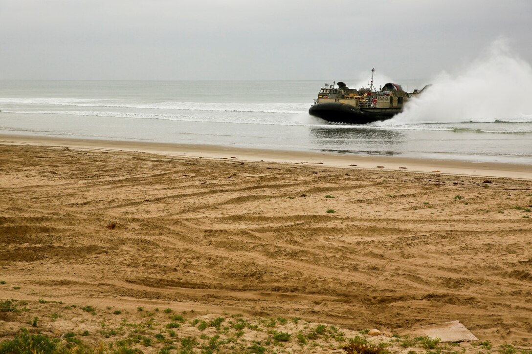 A Landing Craft, Air Cushion with Assault Craft Unit 5, performs an amphibious landing during Exercise Iron Fist 2014 aboard Camp Pendleton, Calif., Feb. 19, 2014. Iron Fist is an amphibious exercise that brings together Marines and sailors from the 15th Marine Expeditionary Unit, other I Marine Expeditionary Force units, and soldiers from the Japan Ground Self-Defense Force, to promote military interoperability and hone individual and small-unit skills through challenging, complex and realistic training. (U.S. Marine Corps photo by Lance Cpl. Ricardo Hurtado/Released)