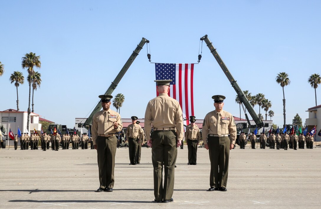 Sergeants Maj. John W. Scott, left, and Douglas B. Schaefer, right, report to Lt. Col. John O’Neal, commanding officer, 15th Marine Expeditionary Unit, during a relief and appointment ceremony aboard Camp Pendleton, Calif., Feb. 21, 2014. Scott will be taking charge as the senior enlisted advisor to Marine Corps Forces Special Operations Command, Camp Lejeune, N.C. (U.S. Marine Corps photo by Cpl. Emmanuel Ramos/Released)