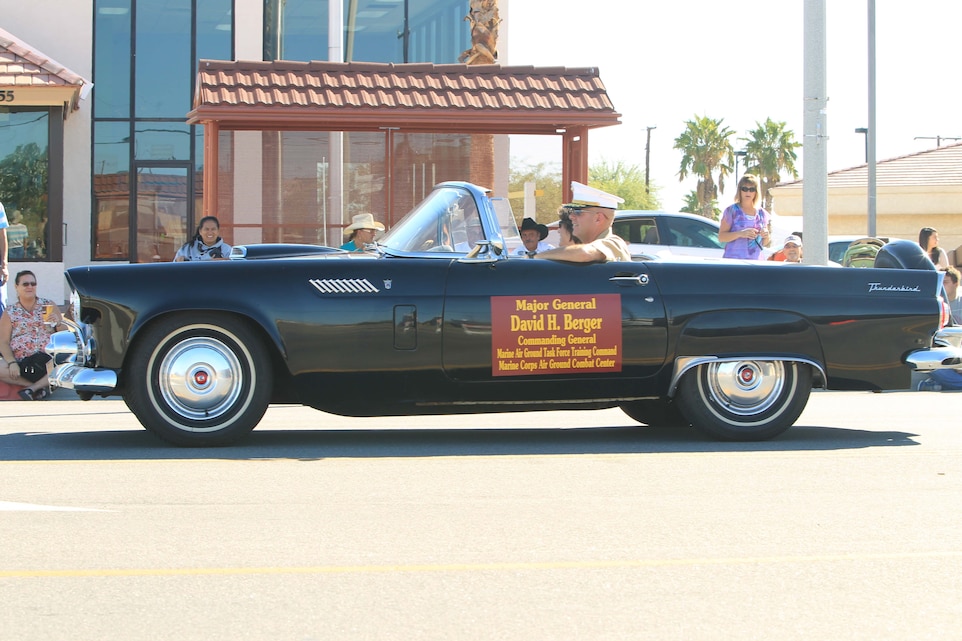 Maj. Gen. David H. Berger, Combat Center commanding general, drives a car down Adobe Road during the 77th annual Pioneer Days Parade Oct. 19, 2013.