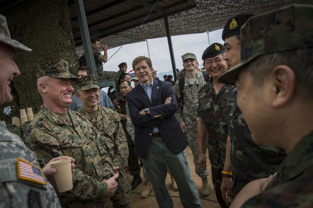 Multinational dignitaries greet each other prior to the start of the combined live-fire exercise during the conclusion of exercise Cobra Gold 2014  at Royal Thai Navy Tactical Training Center Ban Chan Krem, Chanthaburi, Kingdom of Thailand Feb. 21. Cobra Gold, in its 33rd iteration, demonstrates the U.S. and the Kingdom of Thailand's commitment to our long-standing alliance and regional partnership, prosperity and security in the Asia-Pacific region. (U.S. Marine Corps photo by Sgt. Matthew Troyer/Released)