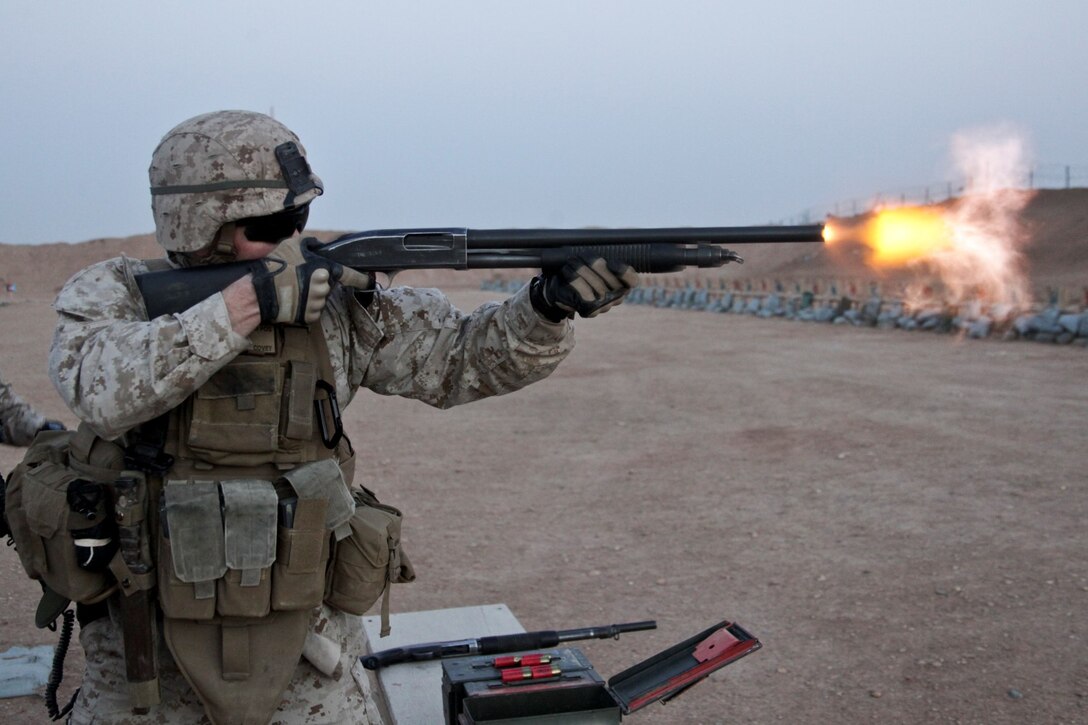 U.S. Marine Corps Capt. James Covey, commanding officer, Headquarters and Service Company, 3rd Battalion, 7th Marine Regiment (3/7), fires an M500 12 gage shotgun on Camp Leatherneck, Helmand province, Afghanistan, Feb. 19, 2014. 3/7 held a shooting competition to maintain their ability to respond to security threats. (Official Marine Corps photo by Cpl. James Mast / Released)