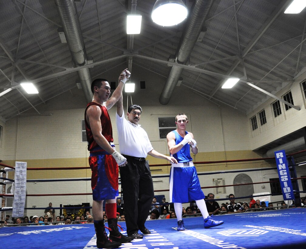 Senior Airman Dustin Southichack of the 433rd Civil Engineering Squadron, is declared the winner over John Van Meter of the Tree City Boxing Club from Uvalde, Texas at the San Antonio Regional Golden Gloves on Feb. 20 at Woodlawn Gym.  Southichack, a light welterweight, is the only Reservist on the All Air Force boxing Team. (U.S. Air Force photo by Tech Sgt. Carlos J. Trevino)