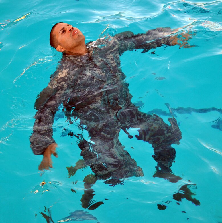 Members of Joint Task Force-Bravo took the Combat Water Survival Test (CWST) at Soto Cano Air Base, Honduras, Feb. 24, 2014. The testing was conducted in the base swimming pool, and required participants to accomplish tasks including swimming 50 meters in uniform and boots, and treading water and floating for five minutes. JTF-Bravo members also trained on helocasting techniques as well as procedures for recovery from water via hoist. The training was conducted in preparation for future JTF-Bravo exercises and operations. (U.S. Air Force photo by Capt. Zach Anderson)