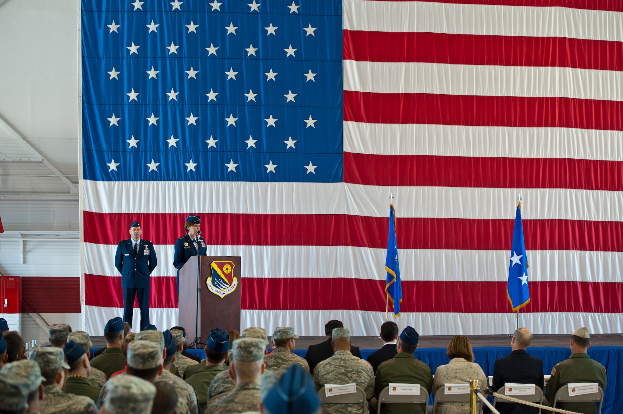 U.S. Air Force Lt. Gen. Lori Robinson, Air Combat Command vice commander, provides opening remarks during an assumption of command ceremony in the Thunderbird hangar Feb. 21, 2014, at Nellis Air Force Base, Nev. Robinson assists the commander in organizing, training, equipping, and maintaining combat-ready forces are ready to meet the challenges of peacetime air sovereignty and wartime defense. (U.S. Air Force photo by Senior Airman Christopher Tam)