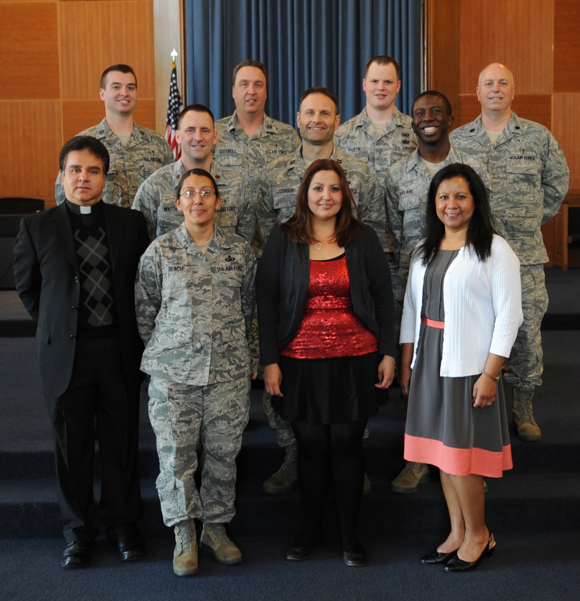 The 7th Bomb Wing Chaplain Corps team, pose in front of the chapel Feb. 14, 2014, at Dyess Air Force Base, Texas. The Chaplain Corps team consists of four active duty chaplains, one reserve chaplain, three chaplain assistants, and four contract positions. The chapel staff emphasizes its role as lead facilitators for the free exercise of religion and providing spiritual care. People who seek counseling are provided absolute confidentiality by the Chaplain Corps team. An on call chaplain is available 24 hours a day, seven days a week for emergency needs. (U.S. Air Force photo by Senior Airman Shannon Hall/Released)