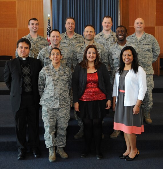 The 7th Bomb Wing Chaplain Corps team, pose in front of the chapel Feb. 14, 2014, at Dyess Air Force Base, Texas. The Chaplain Corps team consists of four active duty chaplains, one reserve chaplain, three chaplain assistants, and four contract positions. The chapel staff emphasizes its role as lead facilitators for the free exercise of religion and providing spiritual care. People who seek counseling are provided absolute confidentiality by the Chaplain Corps team. An on call chaplain is available 24 hours a day, seven days a week for emergency needs. (U.S. Air Force photo by Senior Airman Shannon Hall/Released)