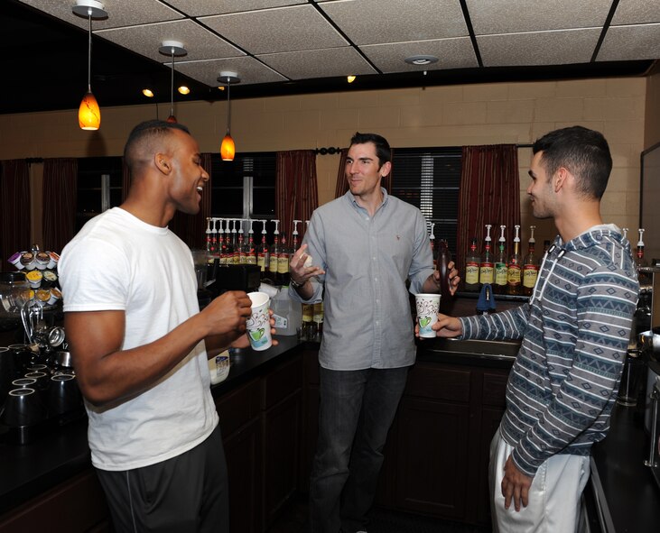 Matt Davis, center, Soul Fire Café manager, trains volunteers  U.S. Air Force Airman 1st Class Tracy Bowen Jr., left, and Airman 1st Class Luis Cruz, right, 7th Aircraft Maintenance Squadron, how to make beverages Feb. 20, 2014, at Dyess Air Force Base, Texas. The Soul Fire Café is a coffee shop and lounge for Airmen ran by the Dyess chapel. The hours of operation are fulfilled by volunteers who concoct non-alcoholic beverages and bake cookies for patrons. It also provides musical equipment, video games, ping-pong tables, and wireless internet access. (U.S. Air Force photo by Airman 1st Class Kedesha Pennant/Released)