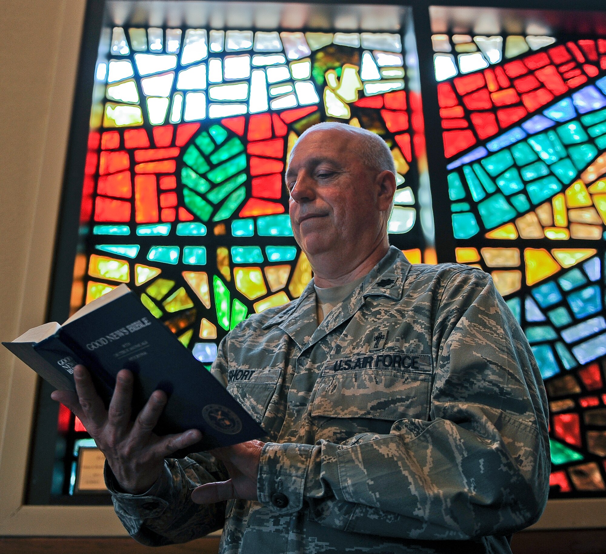 U.S. Air Force Lt. Col. Boyd Short, 7th Bomb Wing chaplain, reads the Bible Feb. 19, 2014, at Dyess Air Force Base, Texas. Short and the Dyess Chaplain Corps team were recently recognized for winning the 2013 Air Combat Command Large Chapel Organization Award. Numerous factors contributed to the award recognition, including being the first in ACC to secure a civilian Catholic priest contract after losing the active duty position. They also facilitated the completion of a construction project, adding 3,000 square feet of new religious education classroom space to the chapel facility. (U.S. Air Force photo by Airman 1st Class Kedesha Pennant/Released)