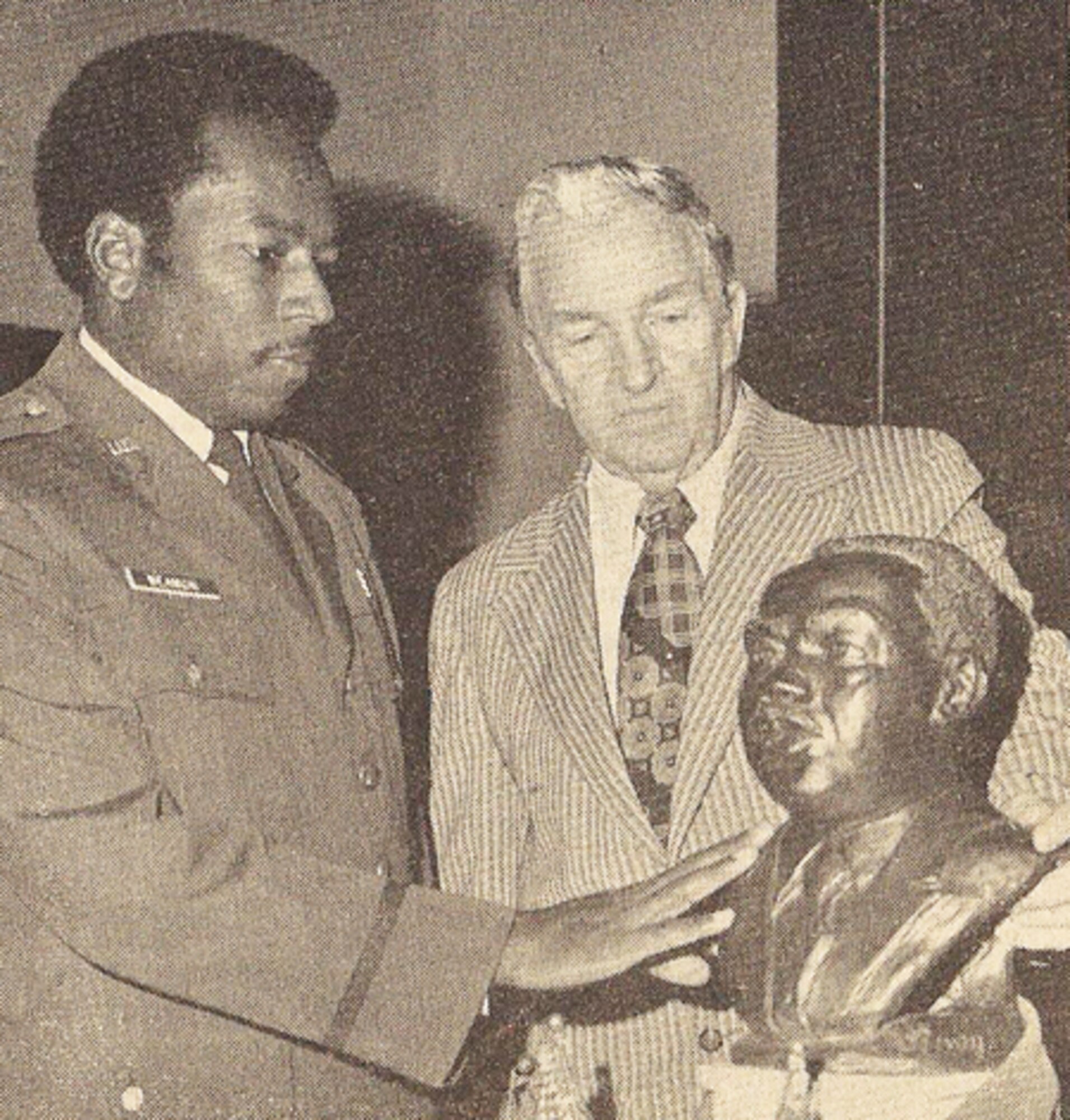 Chaplain (Capt.) Walter Beamon admires the bust of the late Dr. Martin luther King, Jr., sculpytured by George Olney (right) base civil engineer, which was on display during a memorial serviceheld Jan. 15 in the base chapel.  (Published in the February 1975 Minuteman)