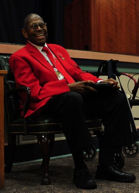 Retired Chief Master Sgt. Walter Richardson laughs after telling a joke to Airmen at Hurlburt Field, Fla., Feb. 19, 2013. Richardson spoke to Airmen about opportunity and perseverance during Black History Month. (U.S. Air Force photo/Staff Sgt. Victoria Sneed)