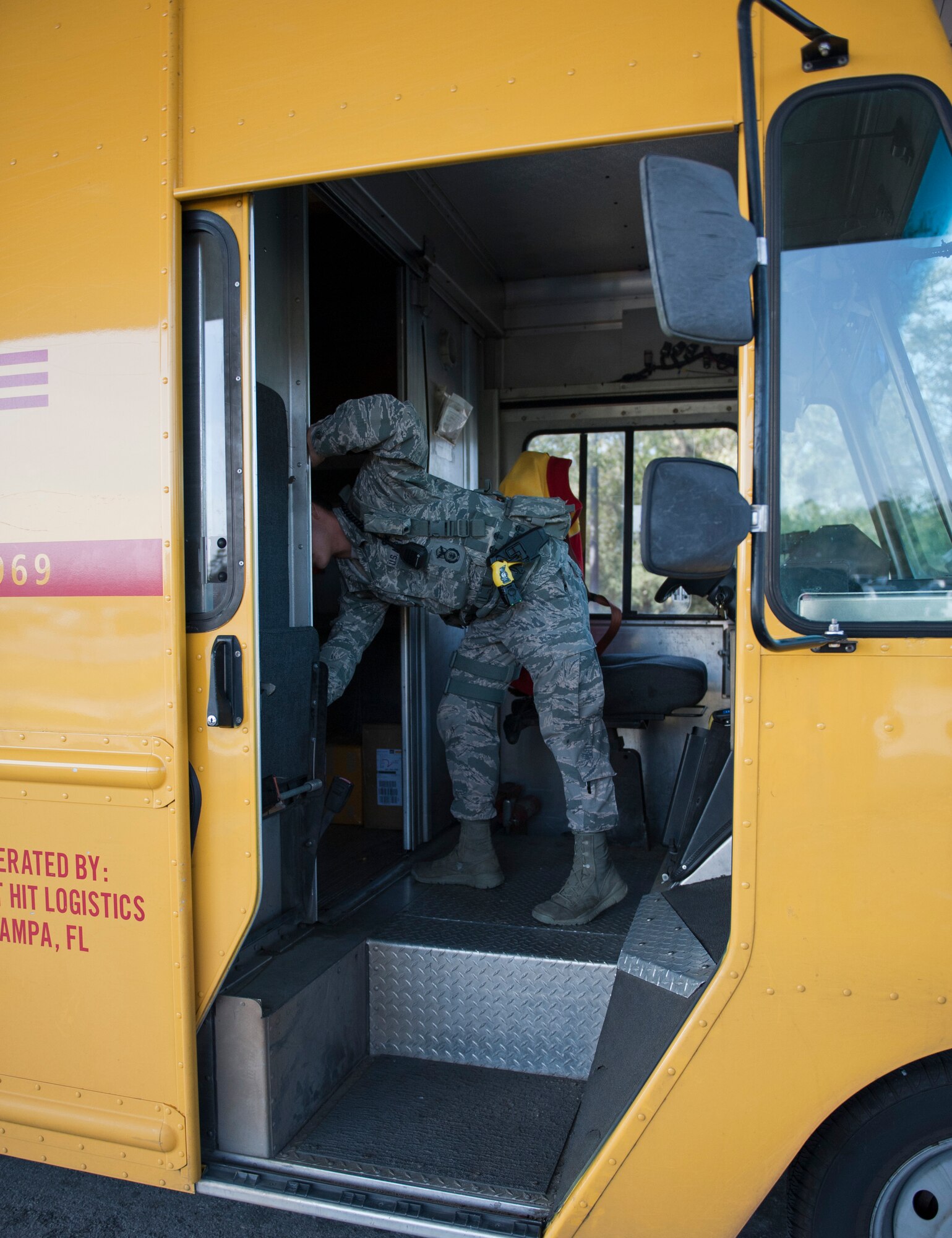 Airman 1st Class Brandon Eddy, 1st Special Operations Security Forces Squadron installation entry controller, inspects the inside of a vehicle at the commercial gate on Hurlburt Field, Fla., Feb. 24, 2014. (U.S. Air Force photo/Senior Airman Krystal M. Garrett)