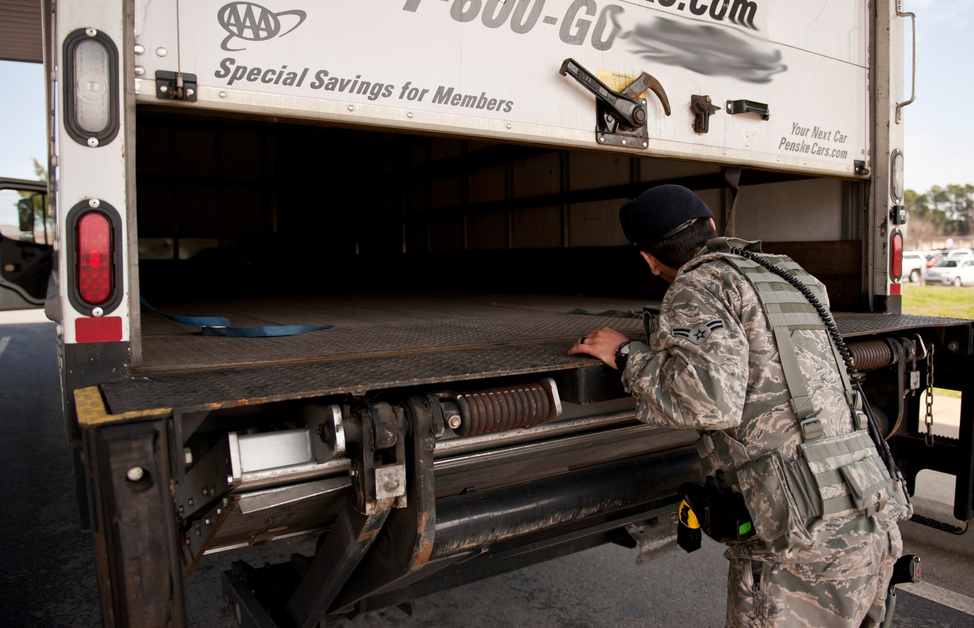 Airman 1st Class Brandon Eddy, 1st Special Operations Security Forces Squadron installation entry controller, checks the back of a truck during an inspection at the commercial gate on Hurlburt Field, Fla., Feb. 24, 2014. (U.S. Air Force photo/Senior Airman Krystal M. Garrett) 