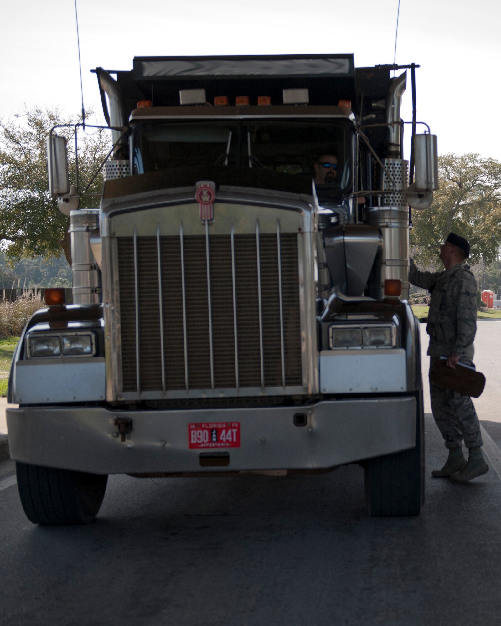 Airman 1st Class Richard Thomas, 1st Special Operations Security Forces Squadron alarm monitor, checks a driver’s license at the commercial gate on Hurlburt Field, Fla., Feb. 24, 2014. (U.S. Air Force photo/Senior Airman Krystal M. Garrett)