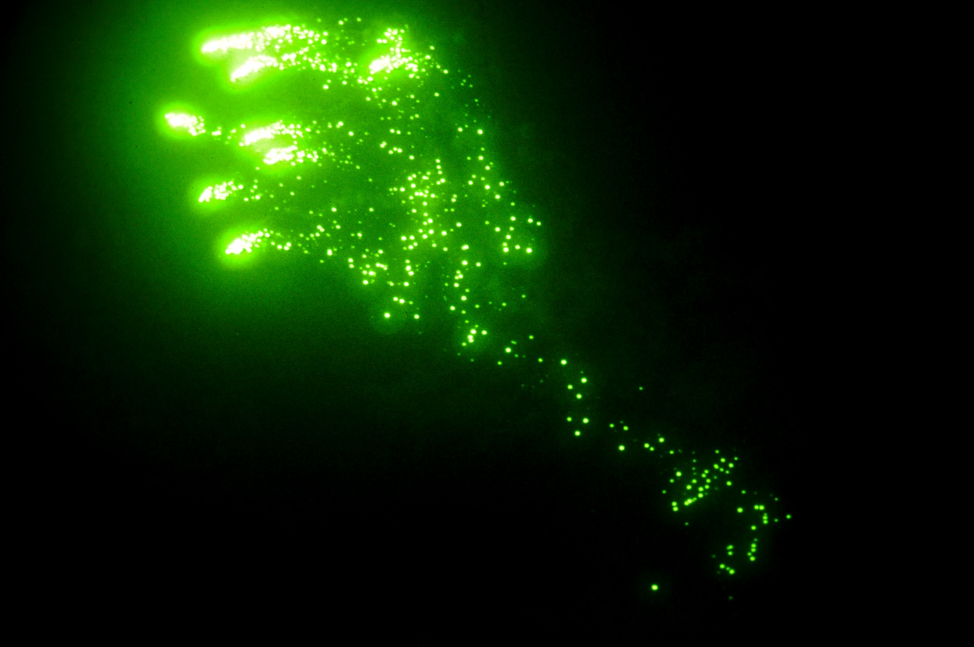 Range support staff shoots off an illumination flare during a night exercise on Eglin Range, Fla., Feb. 20, 2014. During the exercise, range support staff shot off illumination flares and simulated rocket propelled grenades to create a combat-like environment. (U.S. Air Force photo/Senior Airman Michelle Vickers)