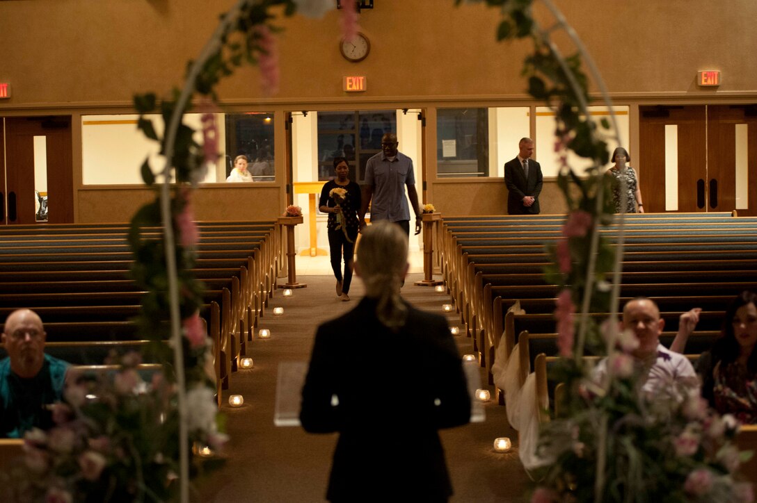 Staff Sgt. Karriem Oliver, 82nd Training wing chaplain assistant, renews his vows with his wife, Tech. Sgt. Samantha Ferguson-Oliver, Feb. 22 at Sheppard. The ceremony took place in the North Chapel. (U.S. Air Force photo by Airman 1st Class Jelani Gibson) 