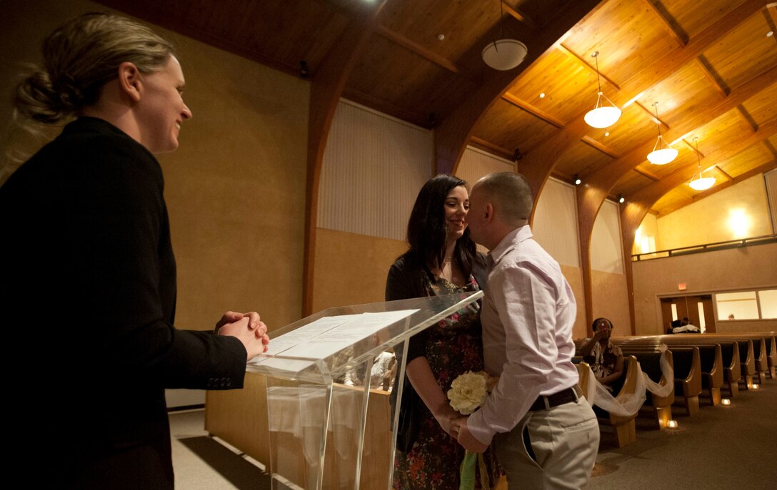 Capt. Kristin Swenson, 82nd Training Wing chaplain, presides over a marriage vow renewal ceremony held at Sheppard Feb. 22. The ceremony was meant to encourage more intimacy and understanding among the couples. (U.S. Air Force photo by Airman 1st Class Jelani Gibson) 