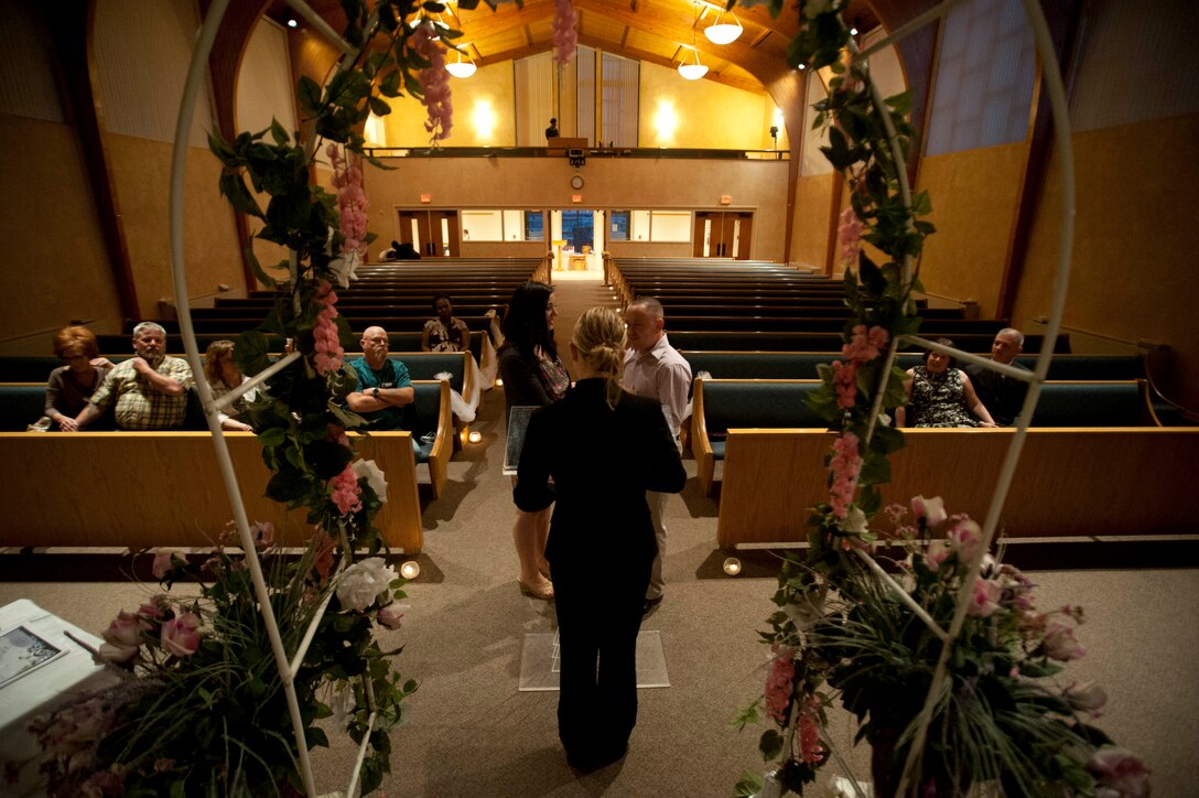 Capt. Kristin Swenson, 82nd Training Wing chaplain, presides over a marriage vow renewal ceremony held at Sheppard Feb. 22. The ceremony was meant to encourage more intimacy and understanding among the couples. (U.S. Air Force photo by Airman 1st Class Jelani Gibson) 
