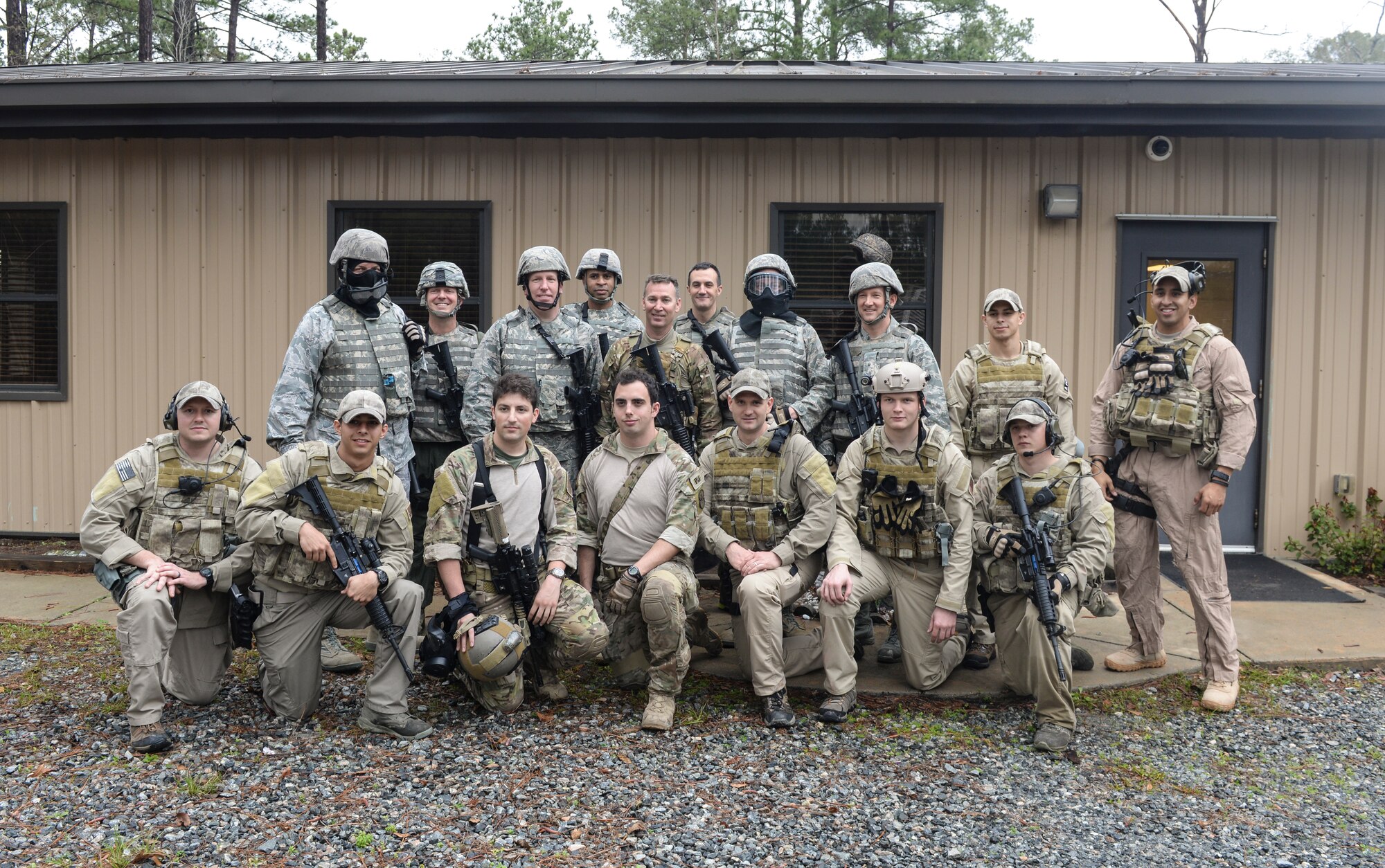 The 23d Wing leadership poses for a group photo with members of the 38th Rescue Squadron and 23d Security Forces Squadron at Moody Air Force Base, Ga., Feb. 21, 2014. The 38th RQS and 23d SFS teamed up to show wing leadership what their job entails while deployed (U.S. Air Force photo by Senior Airman Olivia Bumpers/Released)