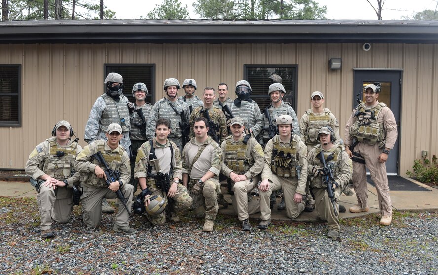 The 23d Wing leadership poses for a group photo with members of the 38th Rescue Squadron and 23d Security Forces Squadron at Moody Air Force Base, Ga., Feb. 21, 2014. The 38th RQS and 23d SFS teamed up to show wing leadership what their job entails while deployed (U.S. Air Force photo by Senior Airman Olivia Bumpers/Released)