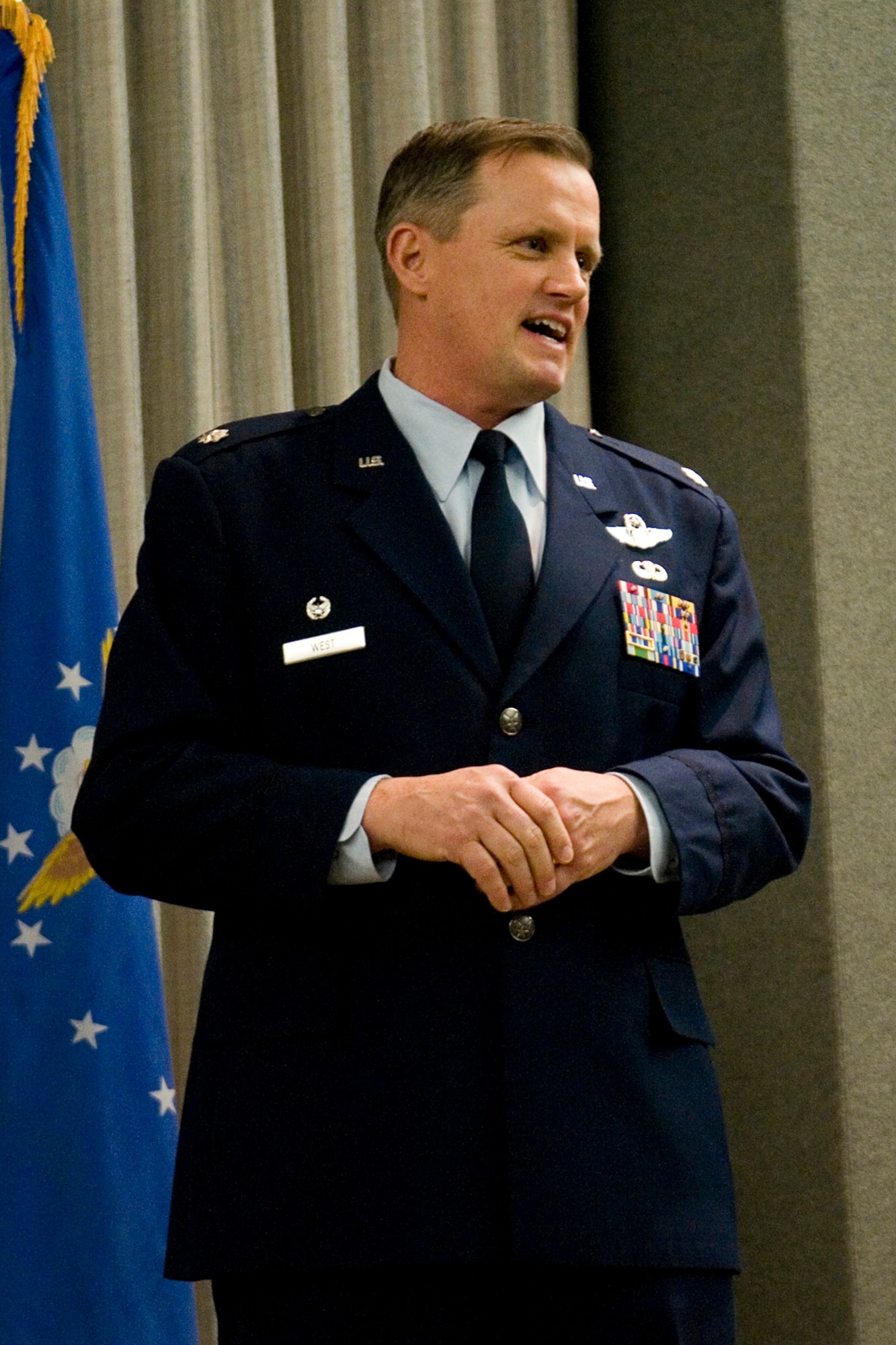 Lt. Col. James West, 74th Air Refueling Squadron commander, speaks to guests at a change of command ceremony at Grissom Air Reserve Base, Ind., Feb. 8, 2014. West was given command of the 74th ARS during the ceremony. (U.S. Air Force photo/Staff Sgt. Andrew McLaughlin)