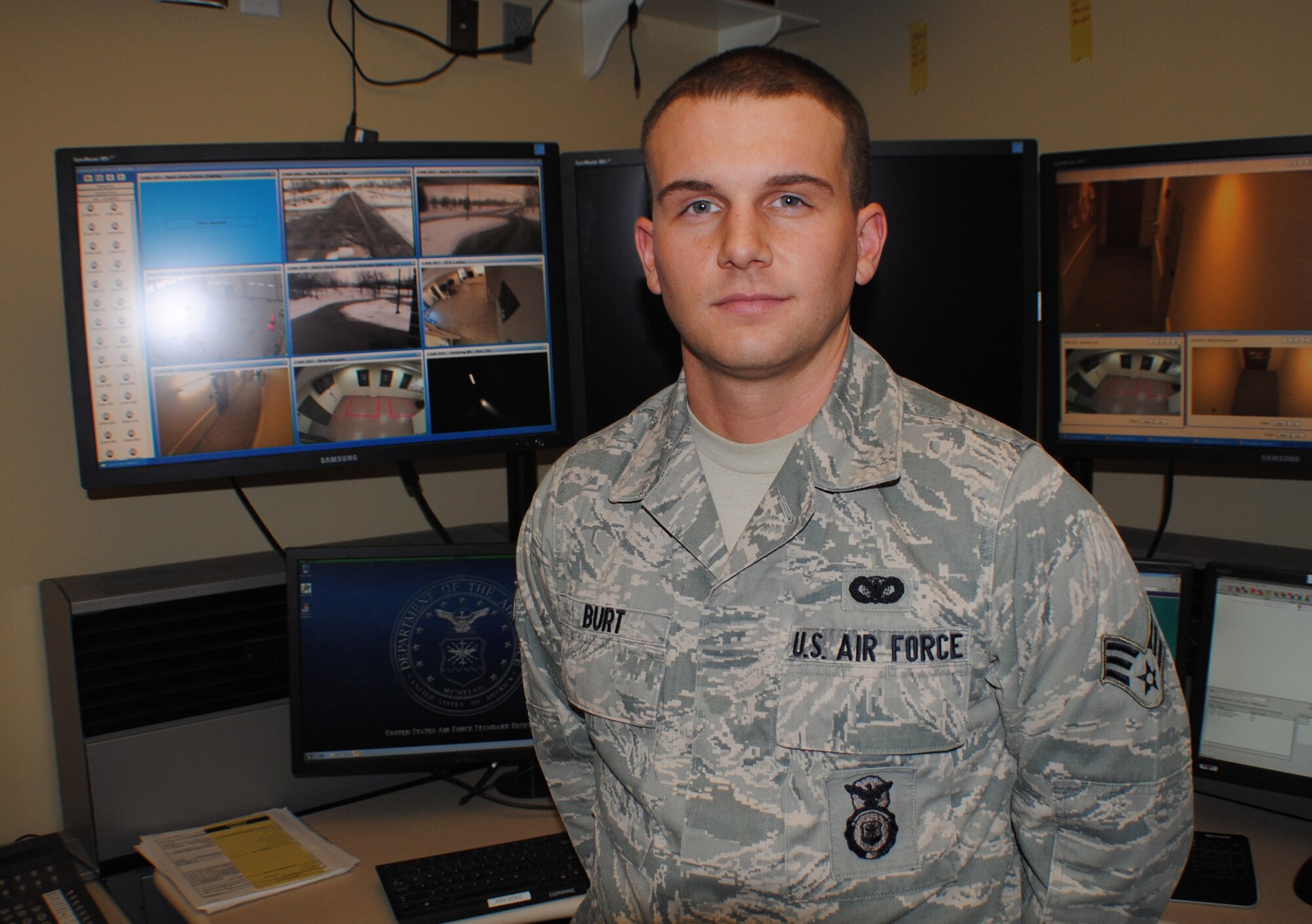 Senior Airman Tyler Burt, 319th Security Forces patrolman and alarm monitor, poses for a photo inside the Base Defense Operations Center at Grand Forks Air Force Base, N.D., on Feb. 19, 2014. The 23-year-old Airman from Nettleton, Miss., is the base’s Warrior of the Week for the fourth week of February 2014. (U.S. Air Force photo/Staff Sgt. Luis Loza Gutierrez) 
