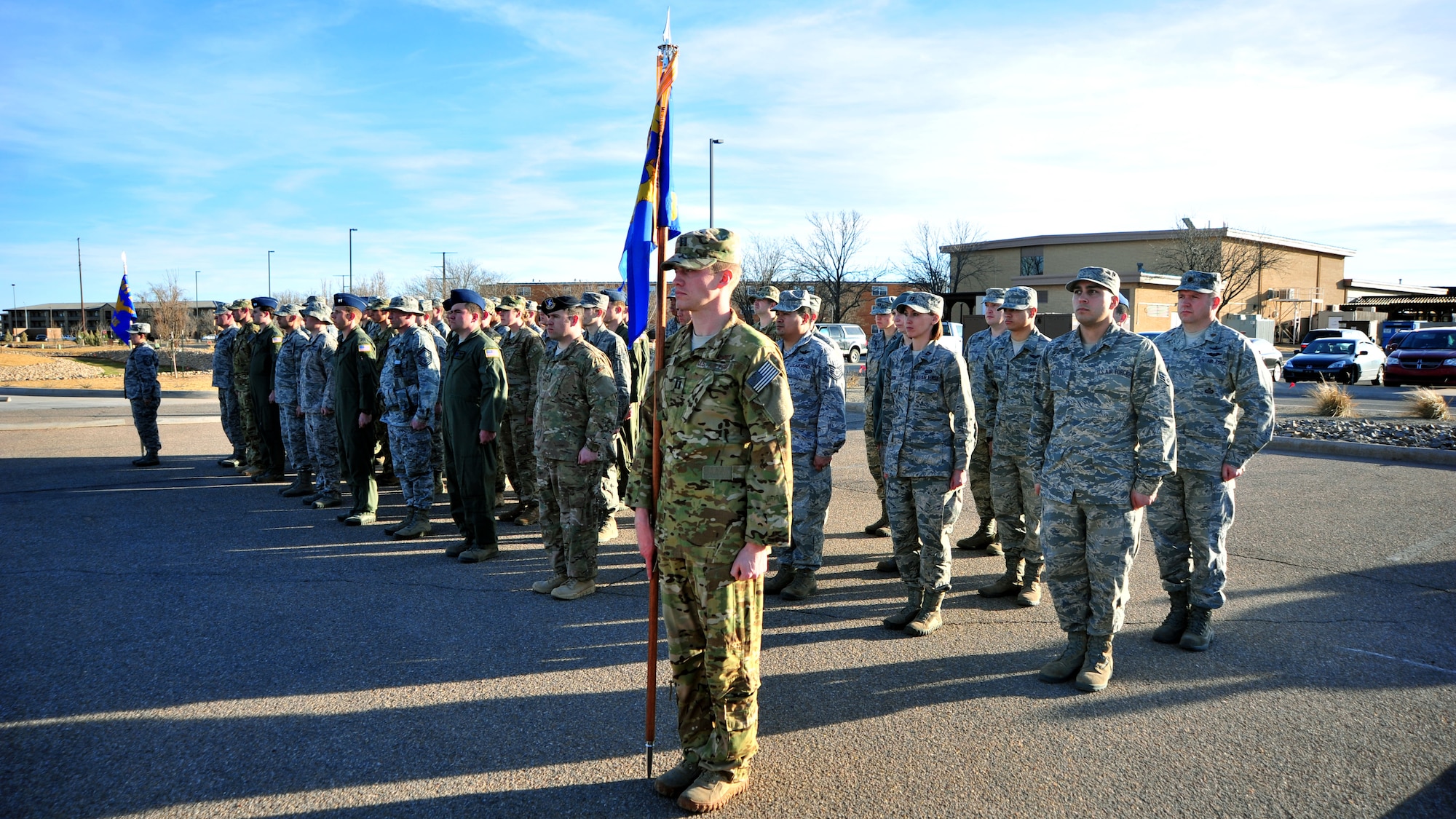 U.S. Air Force Air Commandos from Cannon Air Force Base, N.M., stand at attention during a memorial flag-folding ceremony Feb. 18, 2014 at Cannon Air Force Base, N.M. The ceremony was conducted in honor of Capt. Ryan Hall, Capt. Nicholas Whitlock, 1st Lt. Justin Wilkens and Senior Airman Julian Scholten, the aircrew members who lost their lives when “Ratchet 33”, a U-28A, crashed in Djibouti, Africa, Feb. 18, 2012. (U.S. Air Force photo/Senior Airman Whitney Amstutz)