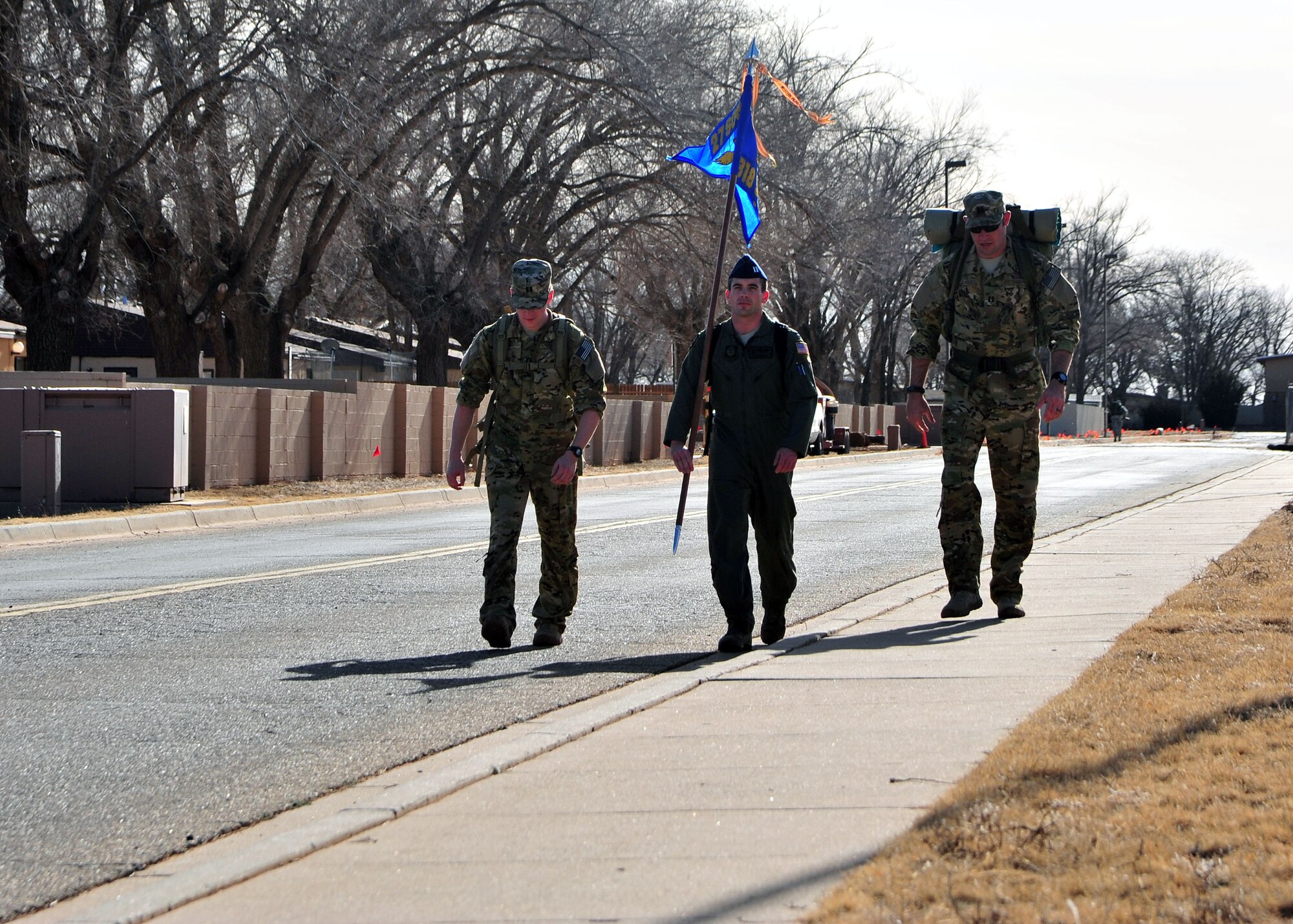 U.S. Air Force Air Commandos from Cannon Air Force Base, N.M., walk during a six-mile memorial ruck march, Feb. 18, 2014 at Cannon’s Unity Park. The march was conducted in honor of Capt. Ryan Hall, Capt. Nicholas Whitlock, 1st Lt. Justin Wilkens and Senior Airman Julian Scholten, the aircrew members who lost their lives when “Ratchet 33”, a U-28A, crashed in Djibouti, Africa, Feb. 18, 2012. (U.S. Air Force photo/Senior Airman Whitney Amstutz)