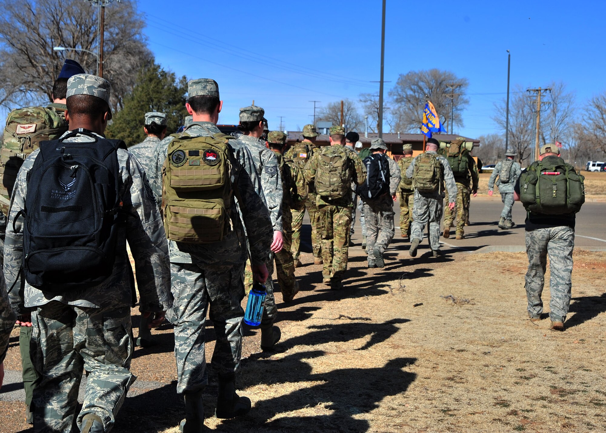 U.S. Air Force Air Commandos from Cannon Air Force Base, N.M., begin a six-mile memorial ruck march, Feb. 18, 2014 at Cannon’s Unity Park. The march was conducted in honor of Capt. Ryan Hall, Capt. Nicholas Whitlock, 1st Lt. Justin Wilkens and Senior Airman Julian Scholten, the aircrew members who lost their lives when “Ratchet 33”, a U-28A, crashed in Djibouti, Africa, Feb. 18, 2012. (U.S. Air Force photo/Senior Airman Whitney Amstutz)