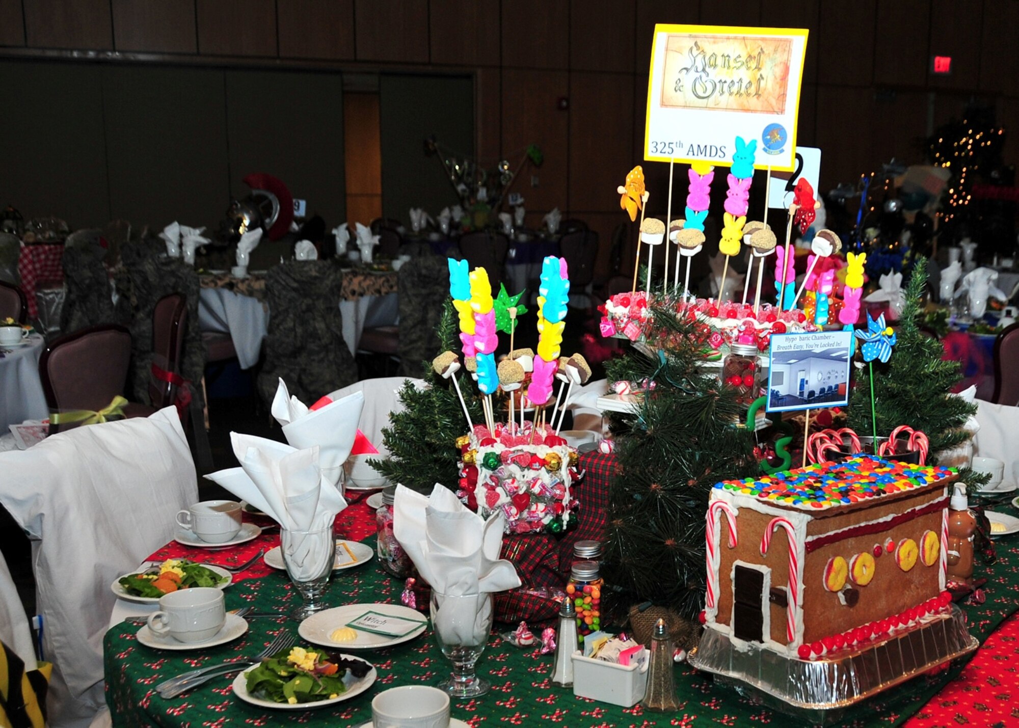 Tables are fairy tale themed during the 1st Annual 325th Fighter Wing Spouse’s Dining-In Feb. 21 at the Horizon’s Activity Center.. (U.S. Air Force photo by Airman 1st Class Sergio Gamboa)