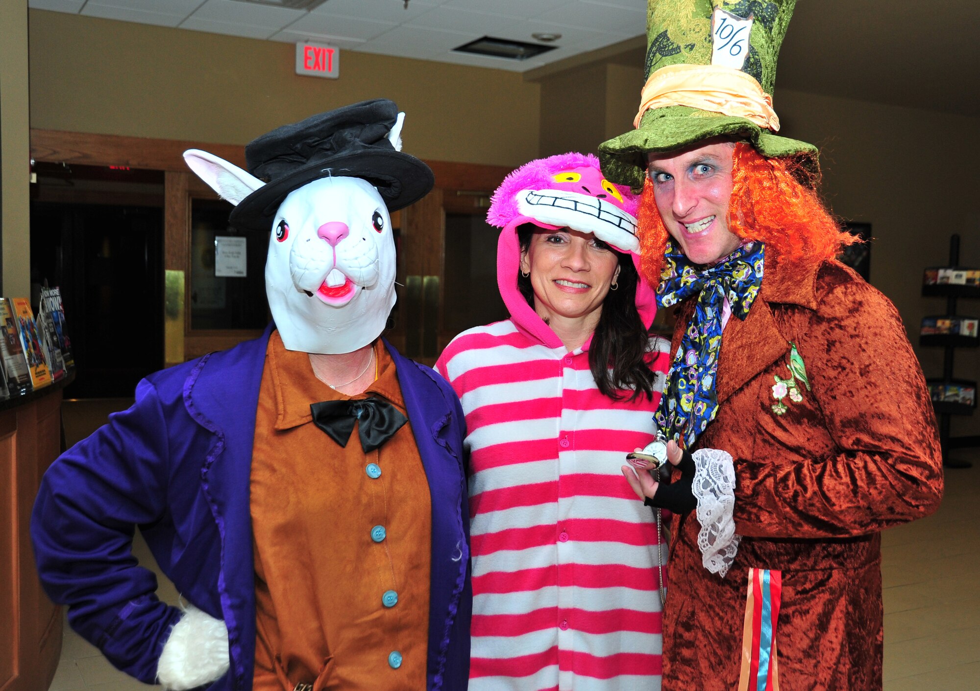 Members of the 325th Comprtroller Squadron pose for a photo in their Alice in wonderland themed costumes for the 1st Annual 325th Fighter Wing Spouse’s Dining-In Feb. 21 at the Horizon’s Activity Center. (U.S. Air Force photo by Airman 1st Class Sergio Gamboa)