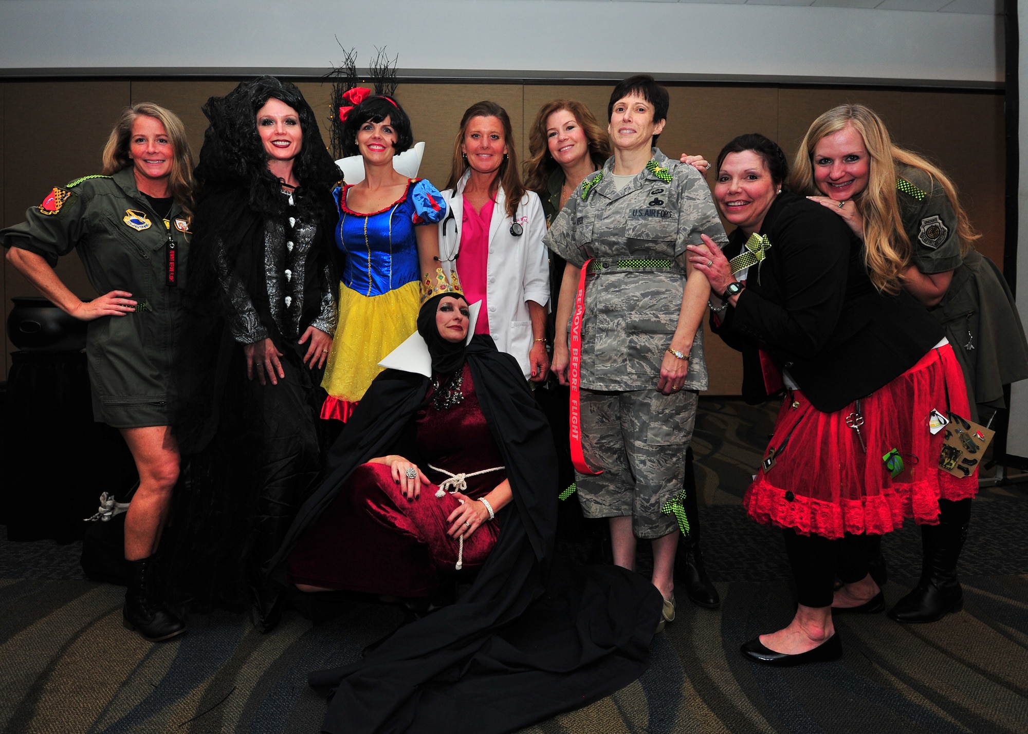 The 325th Fighter Wing leadership spouse’s team pose for a photo in their Snow White themed costumes for the 1st Annual 325th Fighter Wing Spouse’s Dining-In Feb. 21 at the Horizon’s Activity Center. (U.S. Air Force photo by Airman 1st Class Sergio Gamboa)