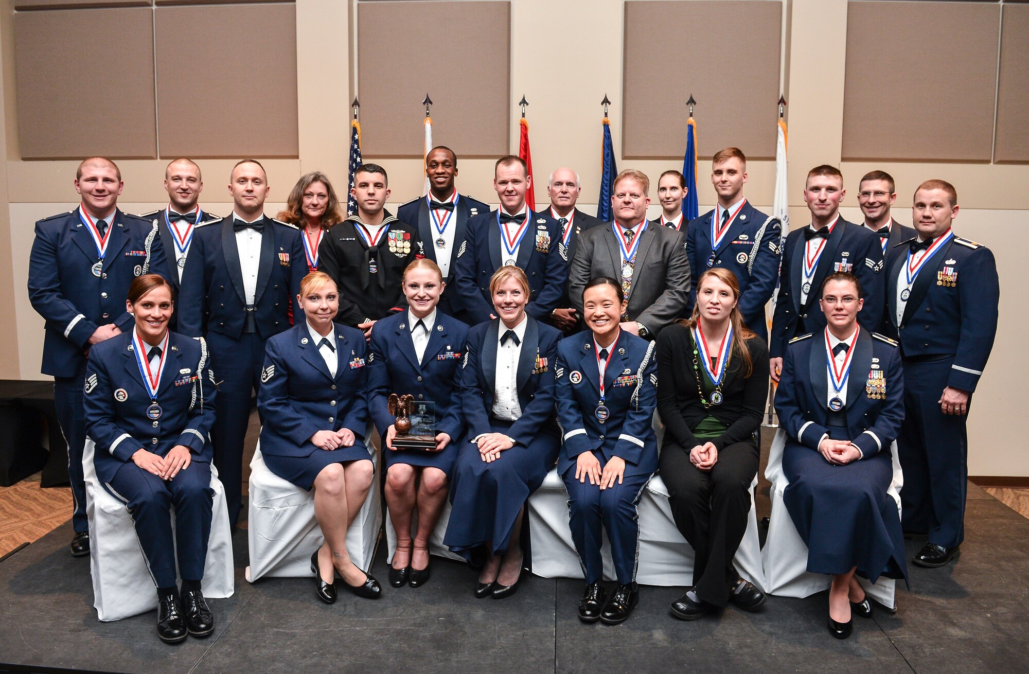 The winners of the 2013 Team Buckley Annual Awards pose after the ceremony Feb. 24, 2014, at the Leadership Development Center on Buckley Air Force Base, Colo. The Team Buckley Annual Awards included 13 individual awards and one team excellence award. (U.S. Air Force photo by Senior Airman Riley Johnson/Released)