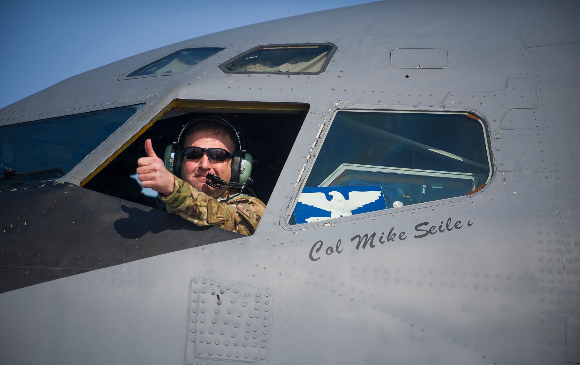Col. Mike Seiler, 376th Expeditionary Operations Group commander, gives a thumbs up after completing the last refueling flight originating from Transit Center at Manas, Kyrgyzstan, Feb. 24, 2014. The KC-135 Stratotanker completed the last TCM refueling mission over Afghanistan before the refueling squadrons left for homestation. (U.S. Air Force photo/Senior Airman George Goslin)