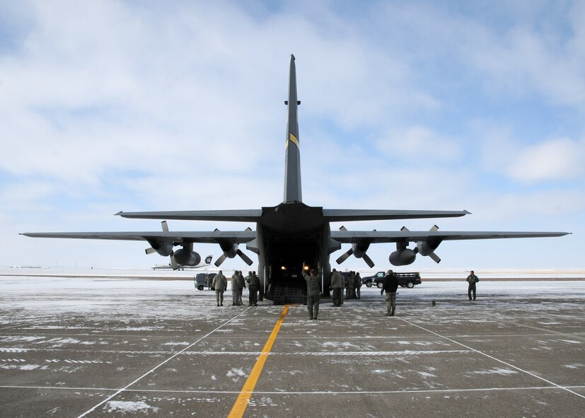 Wyoming Air National Guard members unload a truck at the 120th Fighter Wing Feb. 8, 2014 in preparation for aerial port training during the drill weekend.  National Guard photo/2nd Lt. Robin Jirovsky.