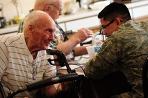 Friends of Veterans, an organization comprised of Minot Airmen from the 791st Missile Security Forces Squadron and the 91st Missile Wing Security Forces Squadron, visited veterans living at Edgewood Vista, an assisted living community in downtown Minot, Feb. 15. (U.S. Air Force Photo/Airman 1st Class Apryl Hall)