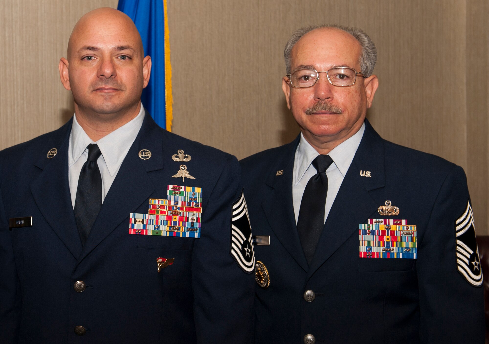 Chief Master Sgt. Jason P. Colon, 91st Operations Group superintendent, and his father, retired Chief Master Sgt. Peter Colon, pose at Colon’s promotion ceremony at Minot Air Force Base, Oct. 31, 2013. While only 1% of enlisted Airmen make chief, the percentage of second generation chiefs is even more rare. (U.S. Air Force photo/Airman 1st Class Apryl Hall)