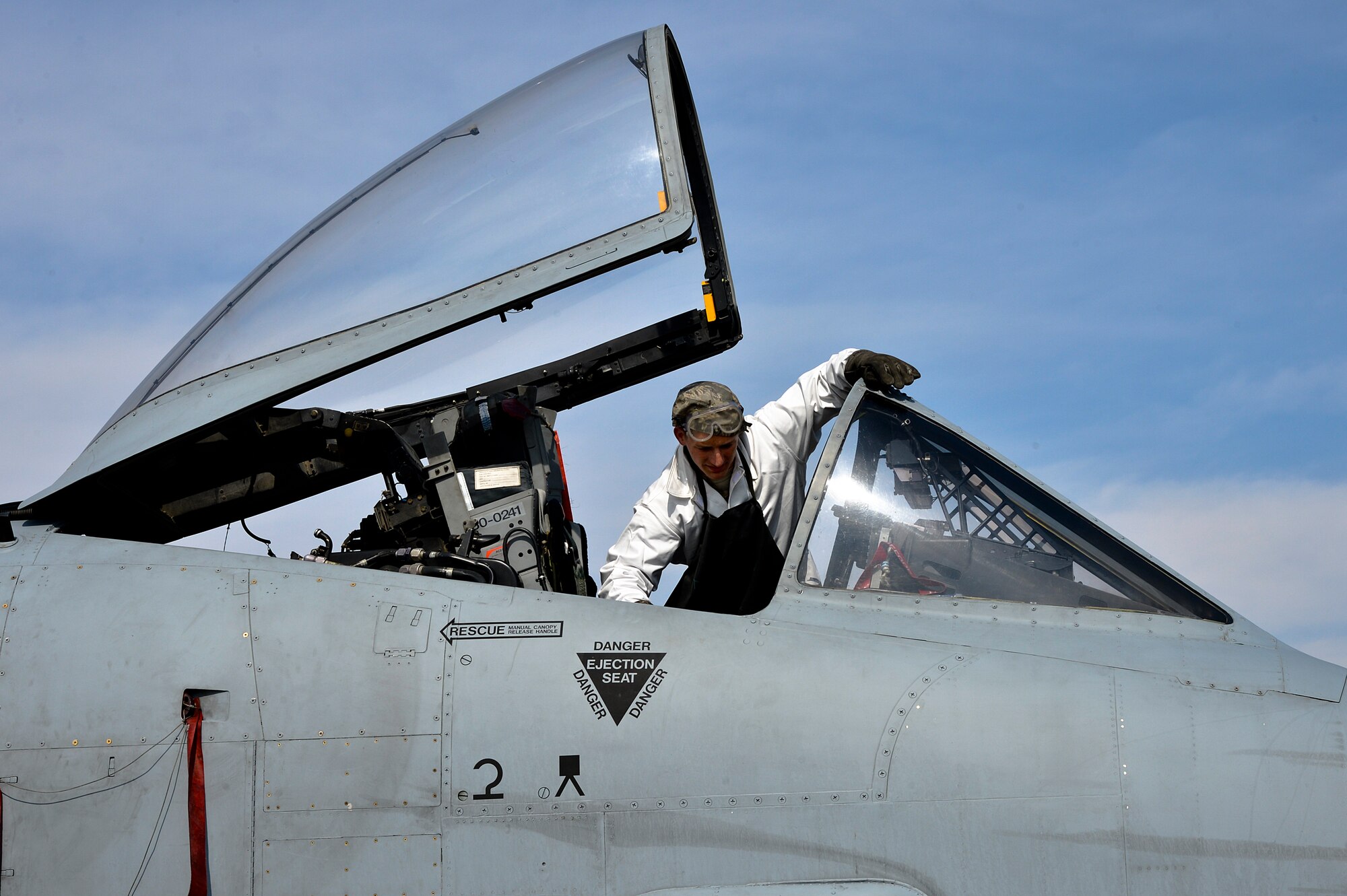 U.S. Air Force Airman 1st Class Chris Lacroix, 455th Expeditionary Aircraft Maintenance Squadron A-10 Thunderbolt II crew chief, checks the oxygen regulators inside an A-10 at Bagram Airfield, Afghanistan, Feb. 21, 2014. Lacroix serviced the A-10 with liquid oxygen which allows pilots the ability to breathe while in the air. (U.S. Air Force photo by Senior Airman Kayla Newman/Released)