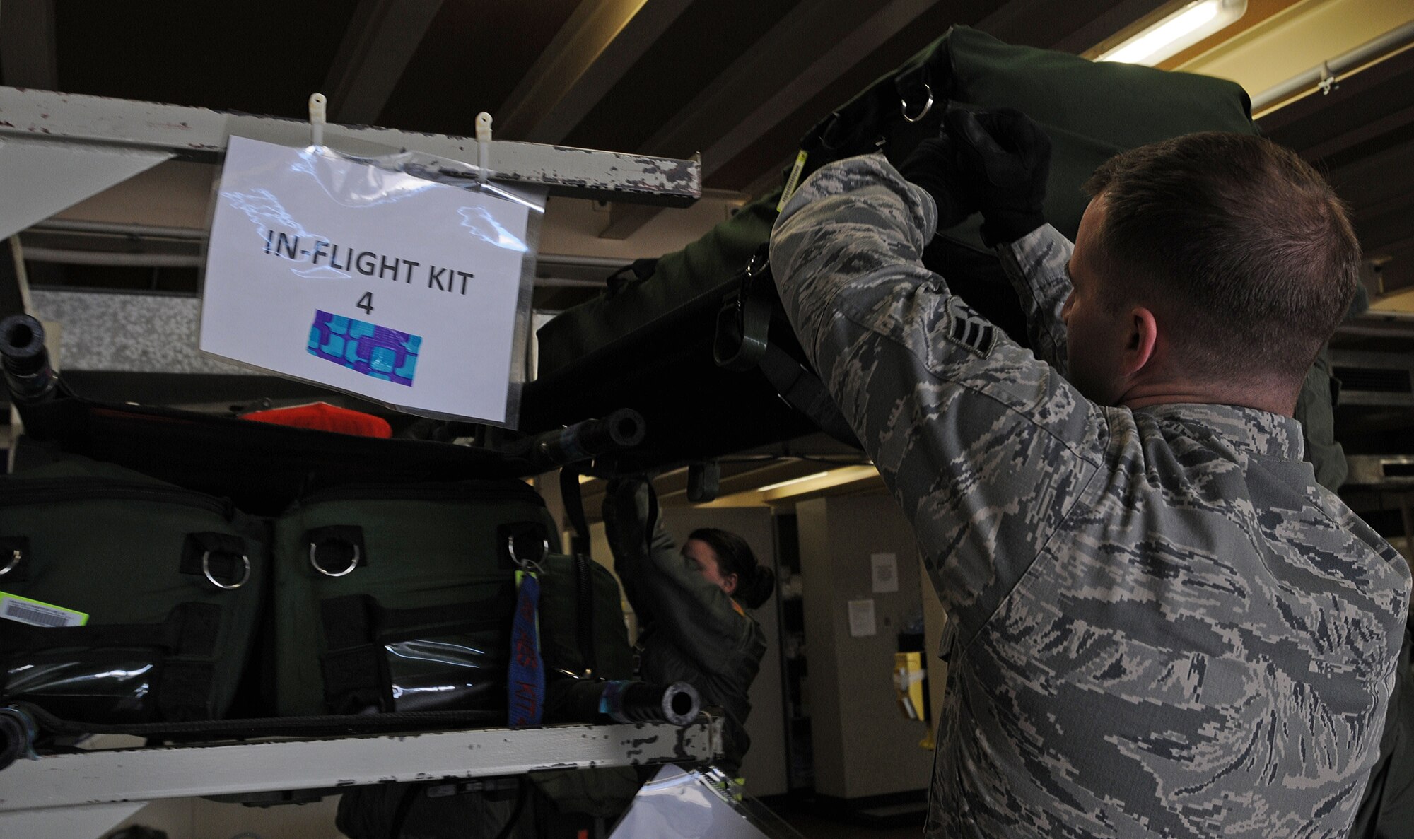 Senior Airman Timothy Jesse, 86th Aeromedical Evacuation Squadron aeromedical evacuation technician, helps unload flight-medical equipment Feb. 20, 2014, Ramstein Air Base, Germany. Members of the 86th AES are responsible for loading injured service members and other government personnel onto aircraft to provide medical care until arriving at a hospital.(U.S. Air Force photo/Airman 1st Class Holly Mansfield)