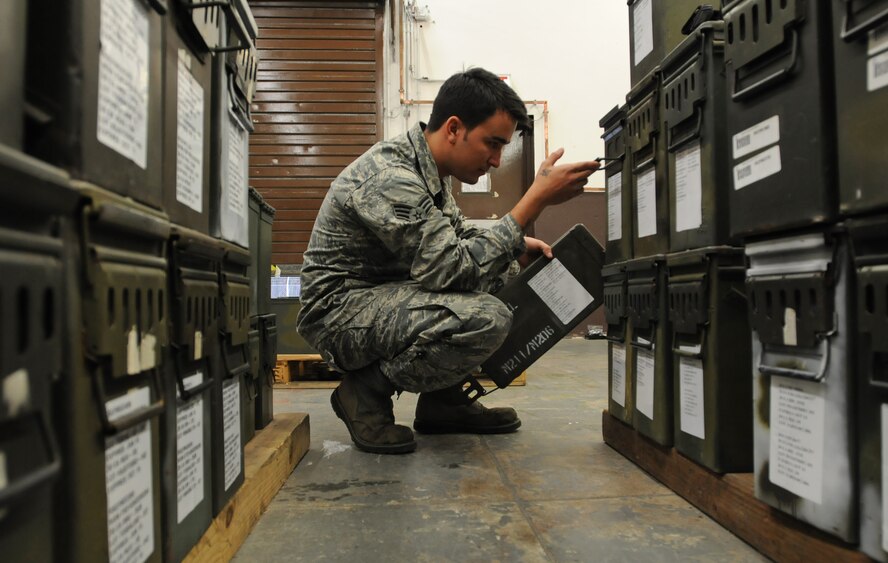 Senior Airman Bryan Sandt, 86th Munitions Squadron maintenance crew chief, makes sure numbers match up on ammunition cans to prepare for a 100 percent accountability inspection Feb. 13, 2014, Ramstein Air Base, Germany. The conventional maintenance shop is in charge of maintaining shelf and service life on countermeasures used in C-130J Super Hercules. They also perform storage monitoring inspections on in-line items kept within the munitions storage area. (U.S. Air Force photo/Airman 1st Class Holly Mansfield)