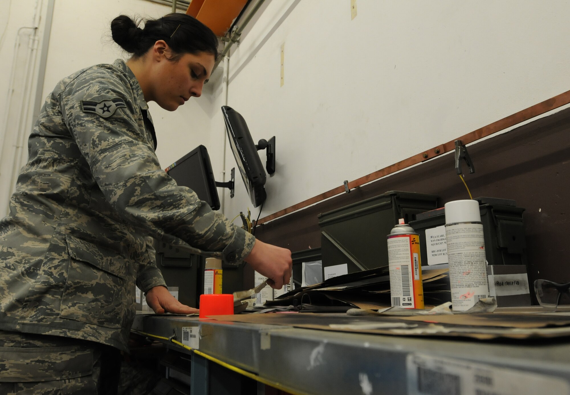 Airman 1st Class Taylor Bauman, 86th Munitions Squadron conventional maintenance crew member, prepares for a 100 percent accountability inspection Feb. 13, 2014, Ramstein Air Base, Germany. The conventional maintenance shop is in charge of maintaining shelf and service life on countermeasures used in C-130J Super Hercules. They also perform storage monitoring inspections on in-line items kept within the munitions storage area. (U.S. Air Force photo/Airman 1st Class Holly Mansfield)