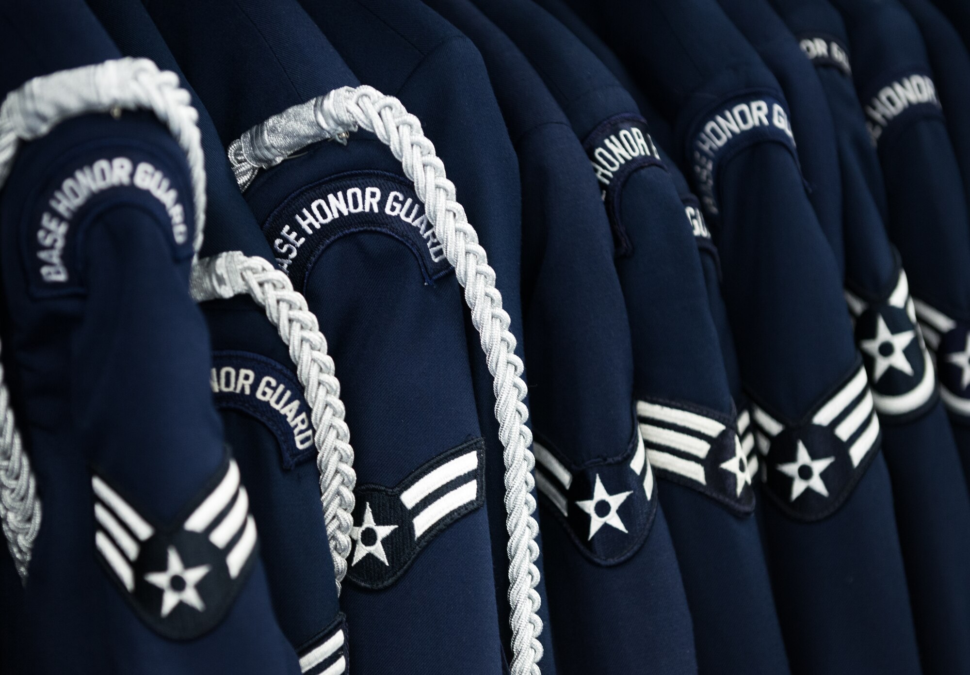 Base honor guard uniforms hang in a row Feb. 19, 2014, Ramstein Air Base, Germany. The mission of the U.S. Air Force Honor Guard is to represent Airmen to the American Public and the World. The vision of the United States Air Force Honor Guard is to ensure a legacy of Airmen who promote the mission, protect the standards, perfect the image and preserve the heritage. (U.S. Air Force photo/Senior Airman Jonathan Stefanko)