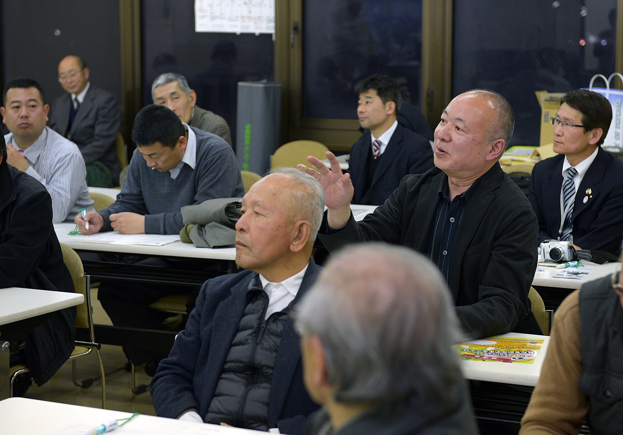 Local civic leaders ask questions to a panel of U.S. Air Force officers from Yokota Air Base, Japan, during the North Kanto Defense Bureau defense seminar in Musashimurayama, Japan, Feb. 21, 2014. The event, which was the first of its kind, allowed the installation to communicate directly with the local community and to answer some of their questions.  (U.S. Air Force photo by Airman 1st Class David Danford/Released)