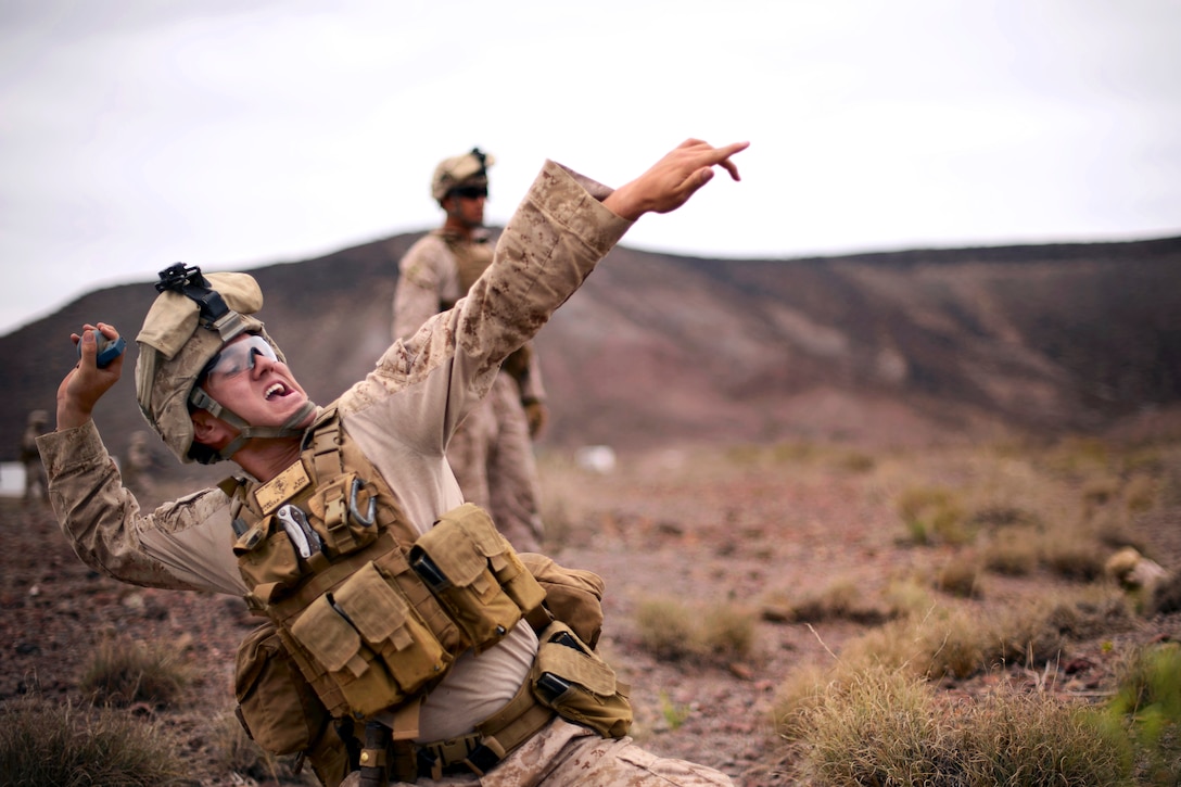 A U.S. Marine throws a training grenade during a live-fire exercise at Arta Range, Djibouti, Feb. 18, 2014. The Marine is assigned to 13th Marine Expeditionary Unit, Battalion Landing Team, Alpha Company, 1st Battalion, 4th Marine Regiment. The unit is deployed with the Boxer Amphibious Ready Group as a theater reserve and crisis response force throughout the U.S. 5th Fleet area of responsibility.