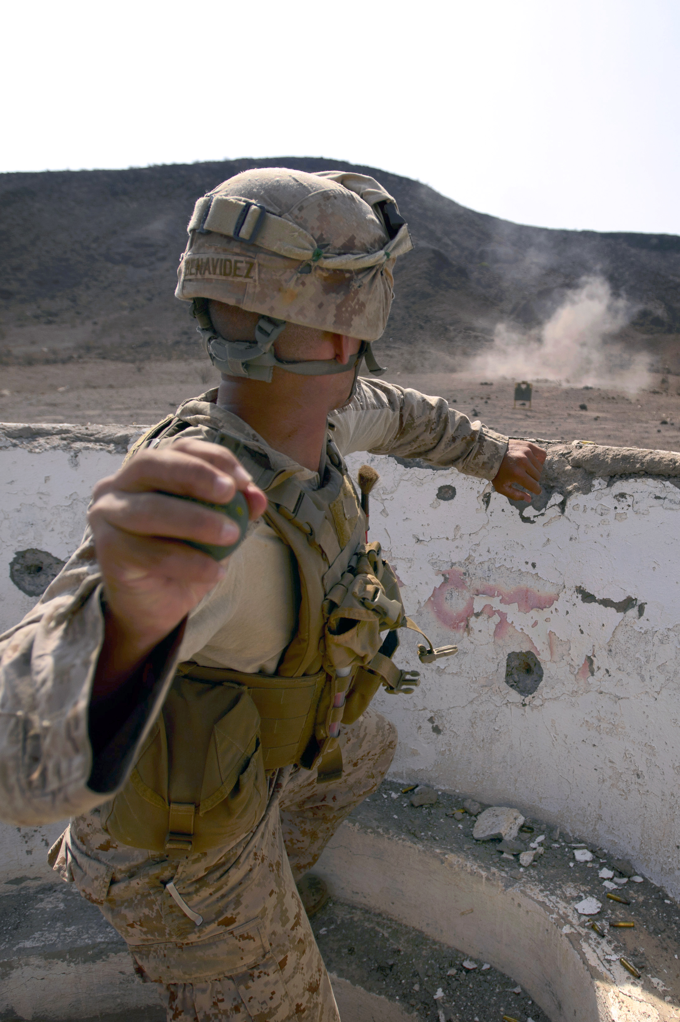 A U.S. Marine throws a live grenade during a livefire exercise at Arta