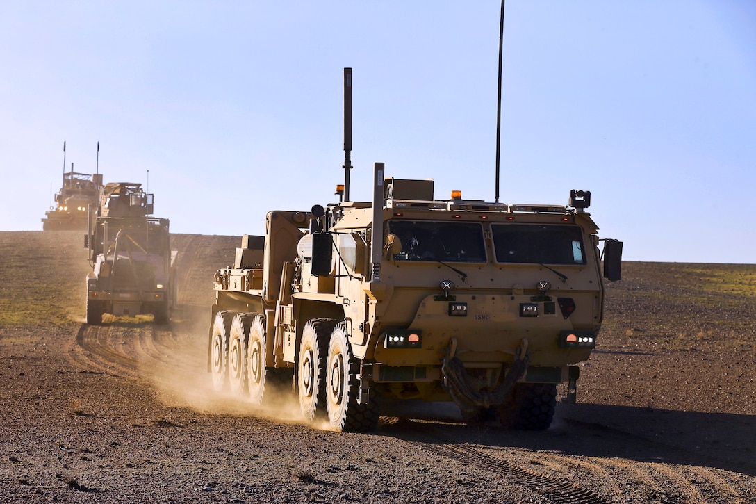 U.S. Marine Corps motor transport operators travel in logistics vehicle ...