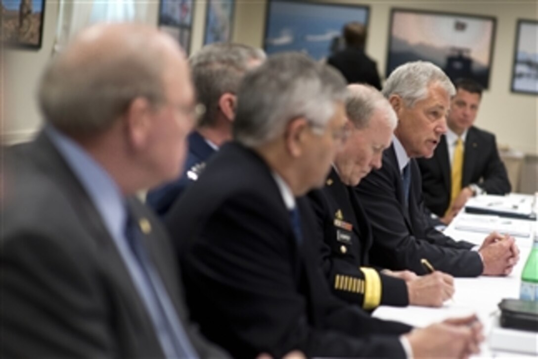 Defense Secretary Chuck Hagel, speaking, meets with members of veteran and military service organizations for a round-table discussion at the Pentagon, Feb. 24, 2014. Army Gen. Martin E. Dempsey, chairman of the Joint Chiefs of Staff, third from left, participated in the meeting.